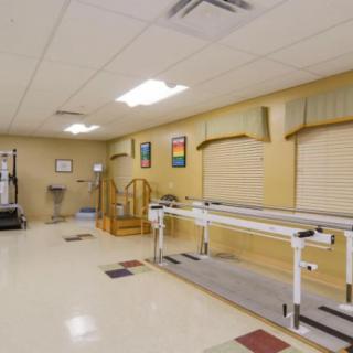 A rehabilitation room equipped with physical therapy equipment.