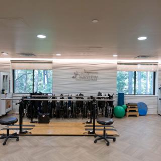 A well-equipped fitness and rehabilitation center with exercise equipment and therapy tools.