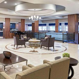 A modern and spacious lobby with comfortable seating and elegant decor.
