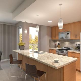 A modern kitchen with a central island and stainless steel appliances.