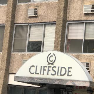 The entrance of the Cliffside building, showcasing its distinctive signage.