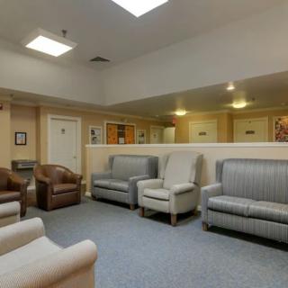 A spacious waiting room with comfortable seating and neutral tones.
