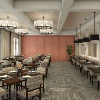 An elegantly designed restaurant interior with neatly arranged tables and chairs.