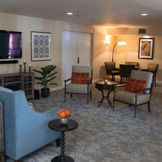 A cozy living room with modern furniture and decor.