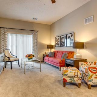 A modern living room with colorful furniture and stylish decor.