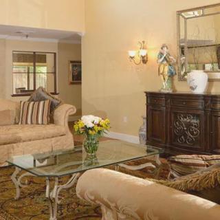 A traditionally styled living room with elegant furniture and decor.