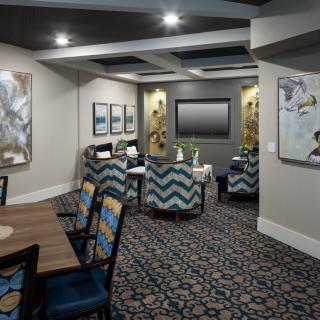 A modern conference room with stylish seating arrangements and contemporary artwork on the walls.