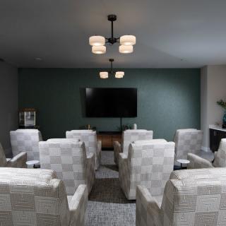 A cozy home theater setup with comfortable seating and ambient lighting.