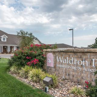 Entrance to Waldron Place neighborhood with well-maintained landscaping.