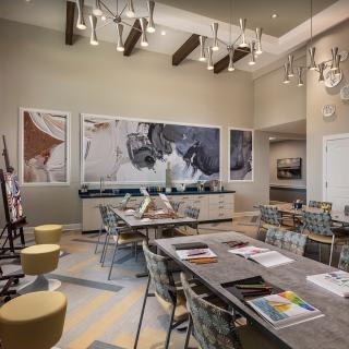 A modern conference room featuring contemporary artwork and stylish lighting fixtures.