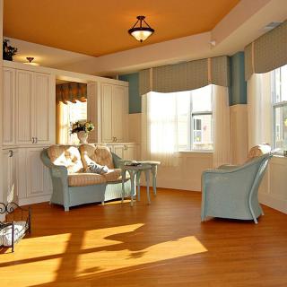 A sunlit living room with modern decor and comfortable seating.