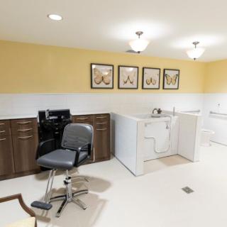 A modern salon interior with chairs and equipment.