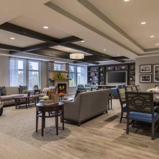 A modern living room with cozy seating and elegant decor.