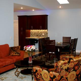 Spacious open-concept living and dining area with vibrant furnishings and elegant decor.