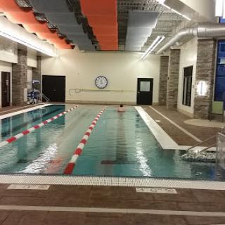 An indoor swimming pool ready for a refreshing swim.