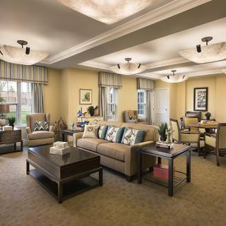A spacious and elegantly designed living room with a comfortable seating area and dining space.