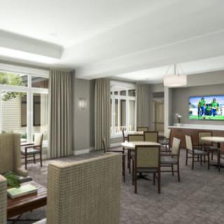 A modern living and dining area with contemporary furniture and a television.