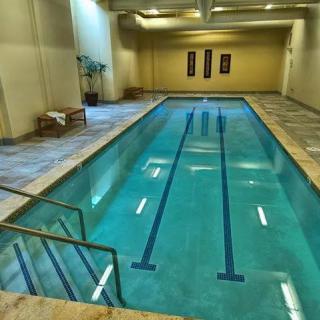 An indoor swimming pool with lanes marked for laps.