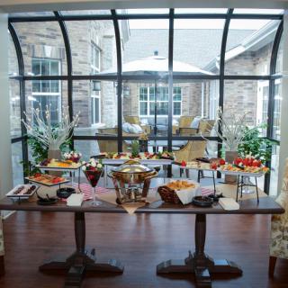 A beautifully arranged buffet table set up for brunch in a bright indoor space.