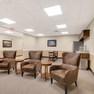 A well-lit lobby with comfortable seating and decor.