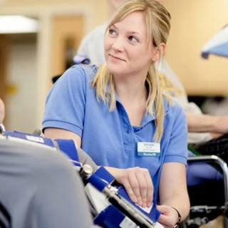A nurse attending to a patient in a hospital setting.