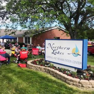 A community gathering at the Northern Lakes center, showcasing a vibrant outdoor event.