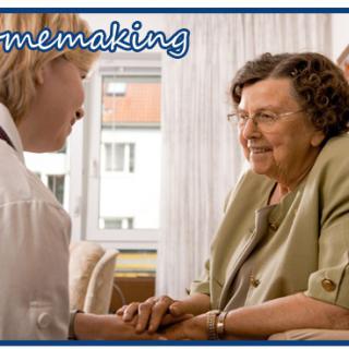 A caregiver offering support and companionship to a senior woman at home.