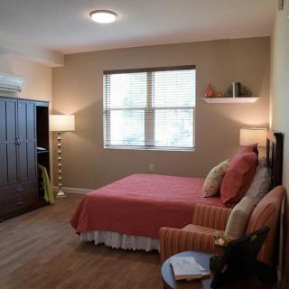 A cozy bedroom with warm lighting and stylish decor.