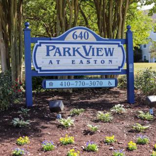 Sign for Park View at Easton amidst landscaped surroundings.