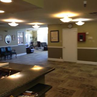 A view of a reception and waiting area with seating arrangements.