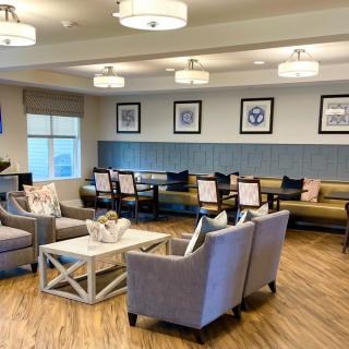 A modern living room with comfortable seating and elegant decor.