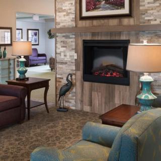 Cozy living room with a fireplace and stylish decor.