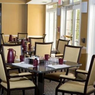 An indoor dining area with neatly arranged tables and chairs.