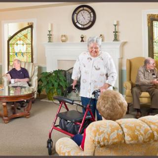 Elderly individuals socializing in a comfortable living room setting at a nursing home.