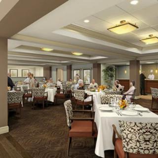 An elegant restaurant dining area with people enjoying meals.