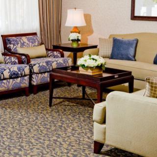 A cozy living room with comfortable seating and elegant decor.