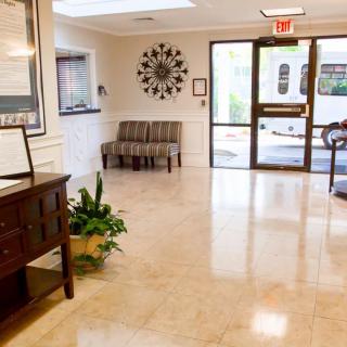 A modern lobby with seating and a reception desk.