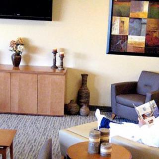 A cozy living room with comfortable seating and decorative elements.