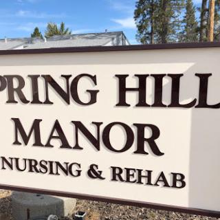 Entrance sign for Spring Hill Manor Nursing & Rehab.