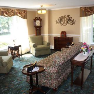 A traditional living room with elegant furniture and decor.
