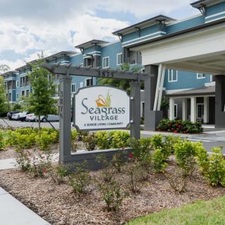 Entrance to Seagrass Village with landscaped surroundings.