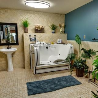 A modern bathroom featuring a walk-in bathtub, surrounded by greenery and elegant decor.