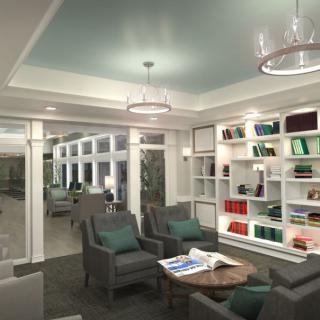 A modern library interior featuring comfortable seating and well-organized bookshelves.