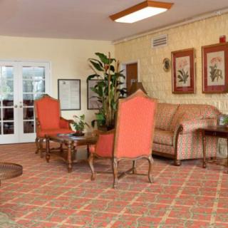 A cozy living room with elegant furniture and decorative elements.