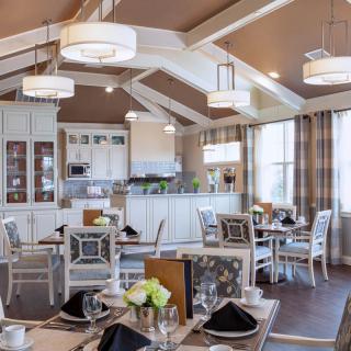 An elegantly designed dining area with stylish furnishings and soft lighting.