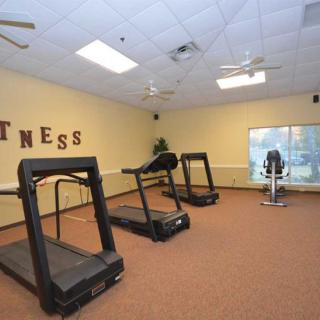 A fitness room with treadmills and exercise equipment.