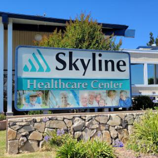 Sign for Skyline Healthcare Center showcasing its services.