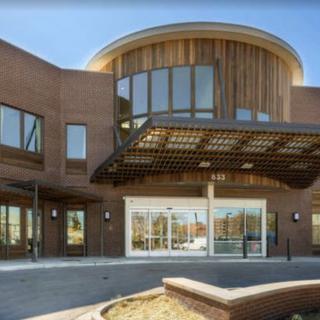 A modern building with a stylish entrance and large windows.