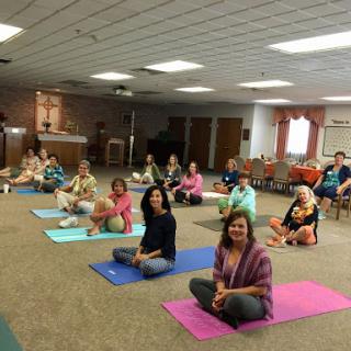 Participants engaged in a yoga class, focusing on wellness and mindfulness.