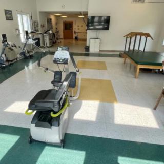 A well-equipped fitness and rehabilitation room with various exercise machines.